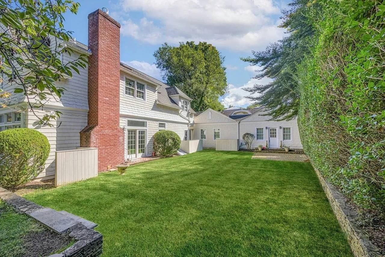Joy Behar’s historic Hamptons home features a heated gunite pool and lush grounds offering complete privacy.