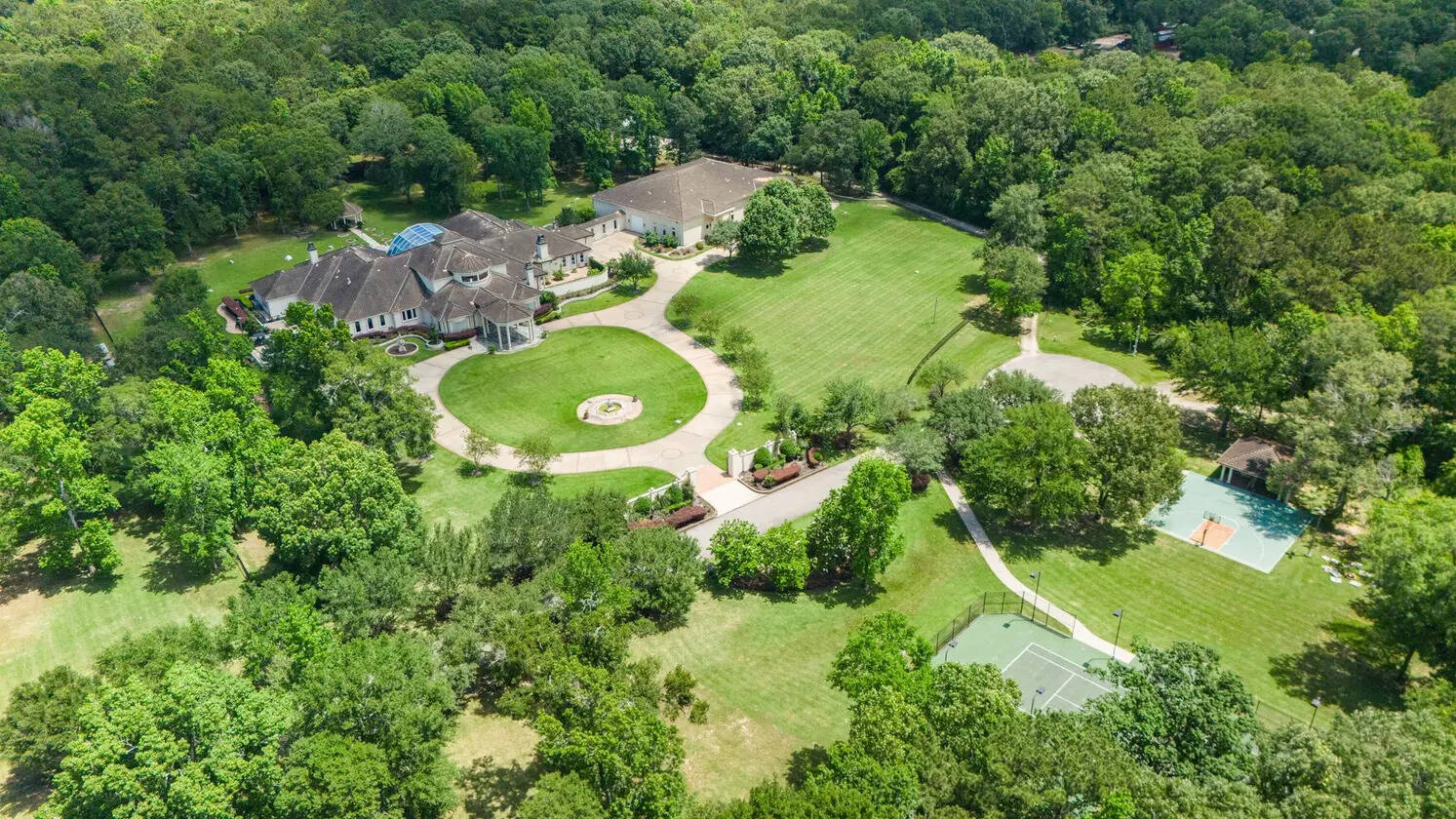 George Foreman’s $6 million estate features a glass atrium, private gym space and expansive grounds.