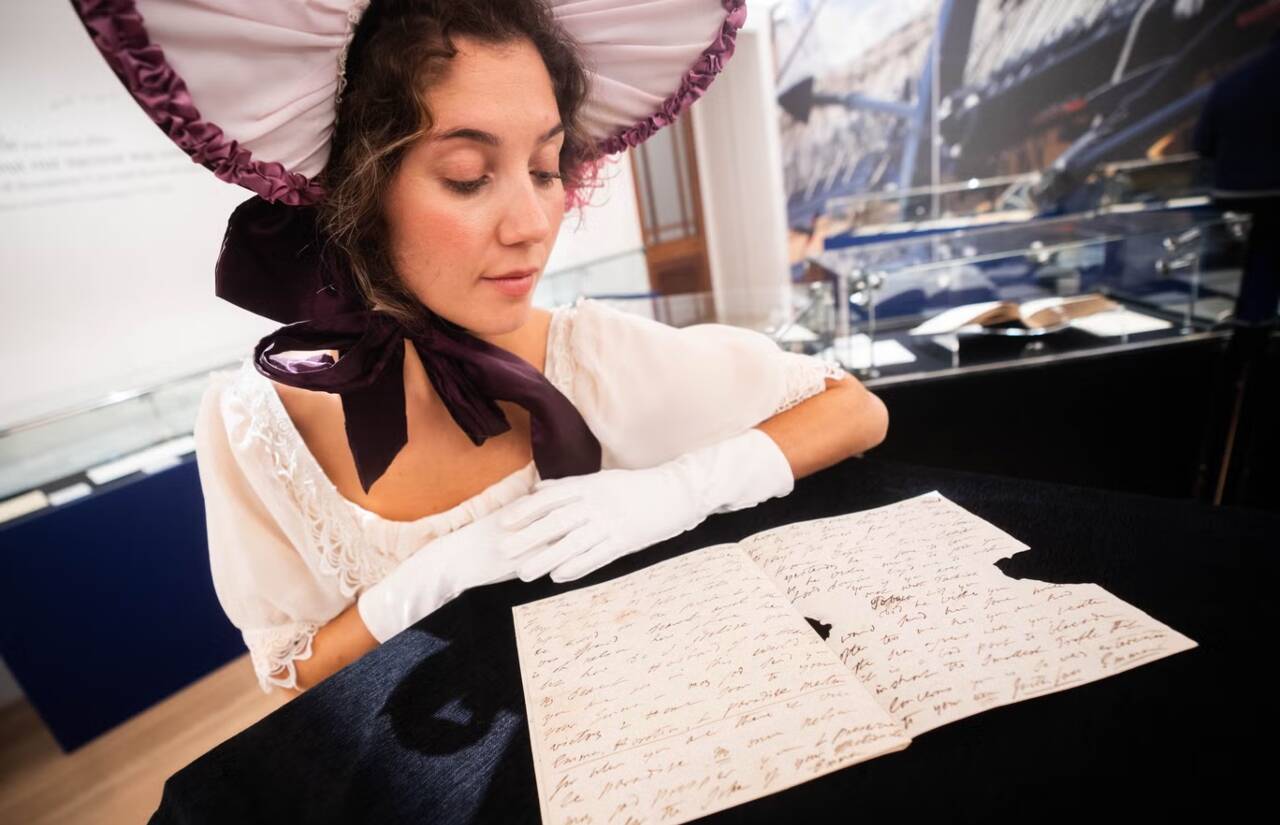 A woman reading letter written by Emma Hamilton's letter