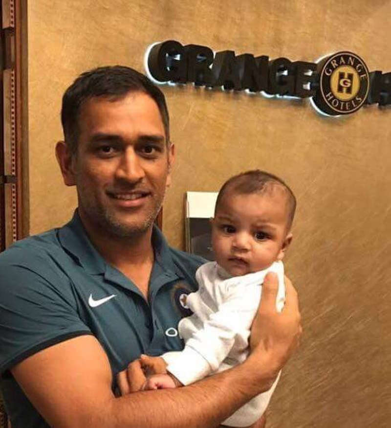 Kohli Yuvraj And Dhoni Pose For Pictures With Azhar Ali S Kids Off The Field News Times Of India