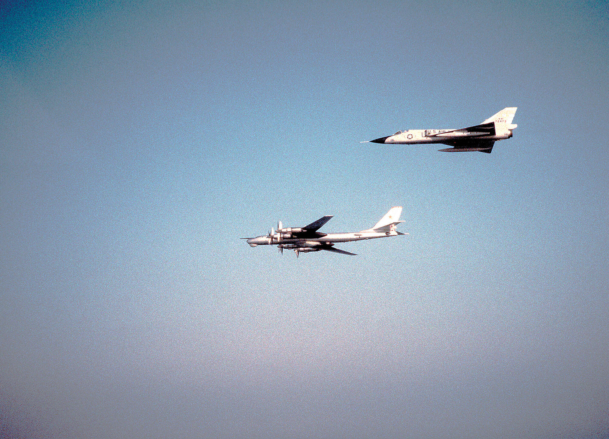 In the 1980s, an F-106 from the Massachusetts Air National Guard intercepts a Tu-95 Bear bomber off the coast of Nova Scotia (USAF)