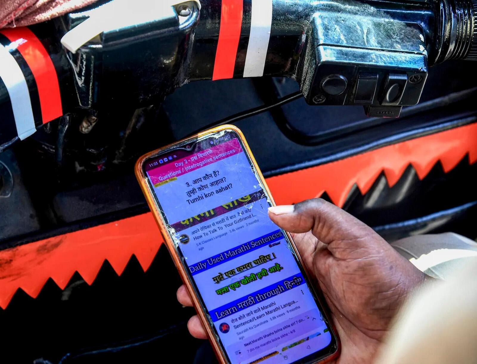 Auto driver watches YouTube to learn Marathi amid mandatory test rule (Photo credit: PTI)
