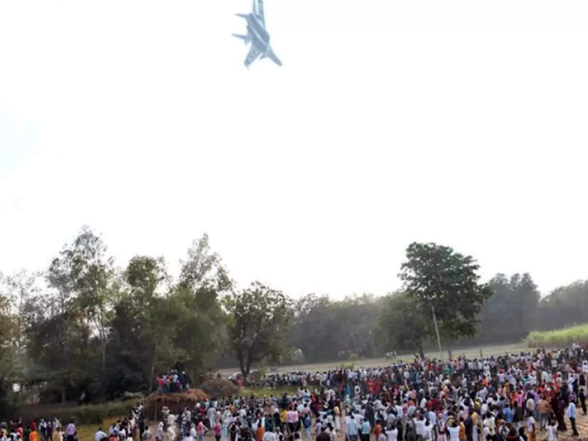 An IAF aircraft flies past during the air show in Sultanpur on Tuesday