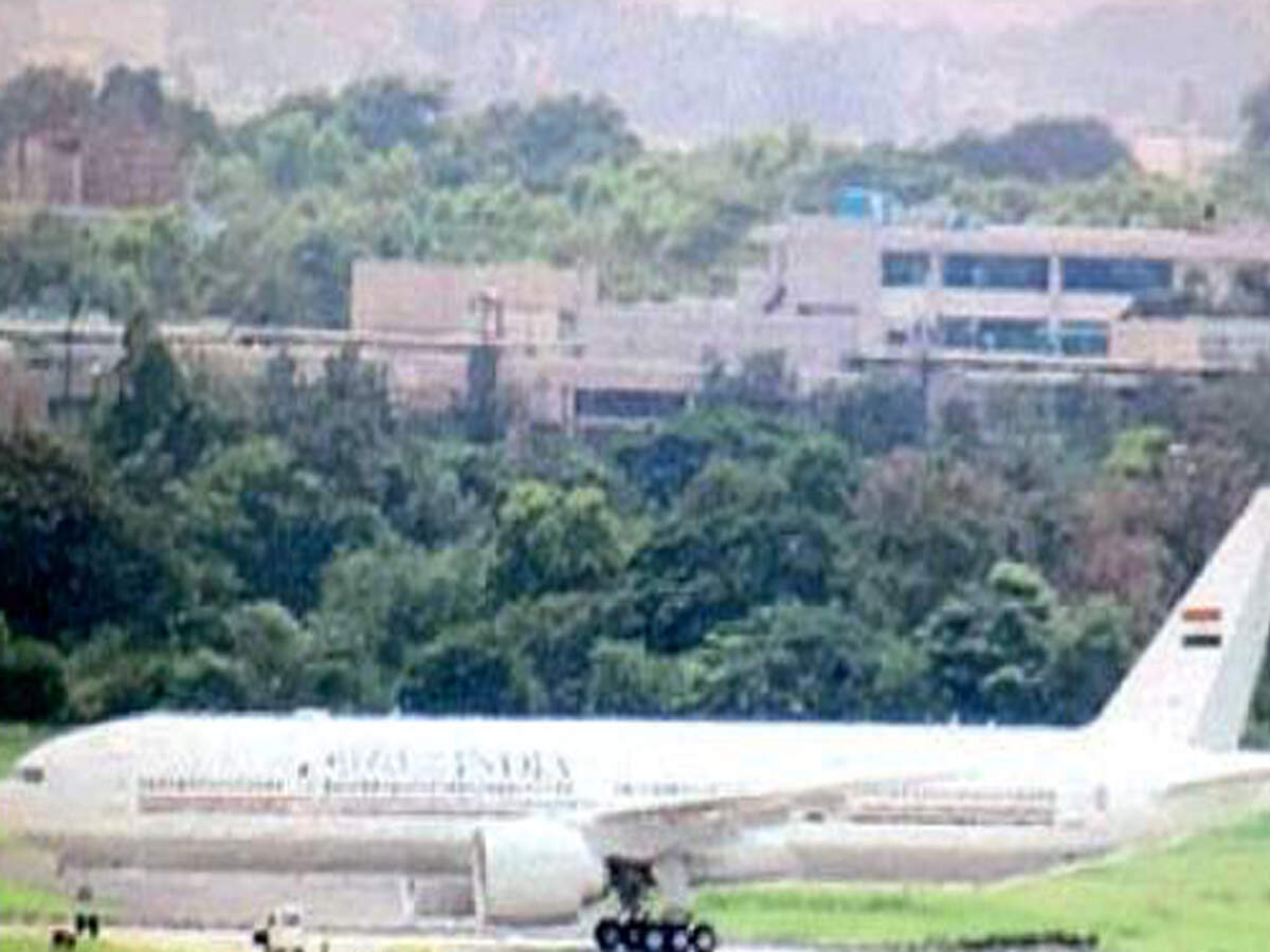 The aircraft stuck off the runway after the pilot taxiing it took a left turn instead of right at the turning pad