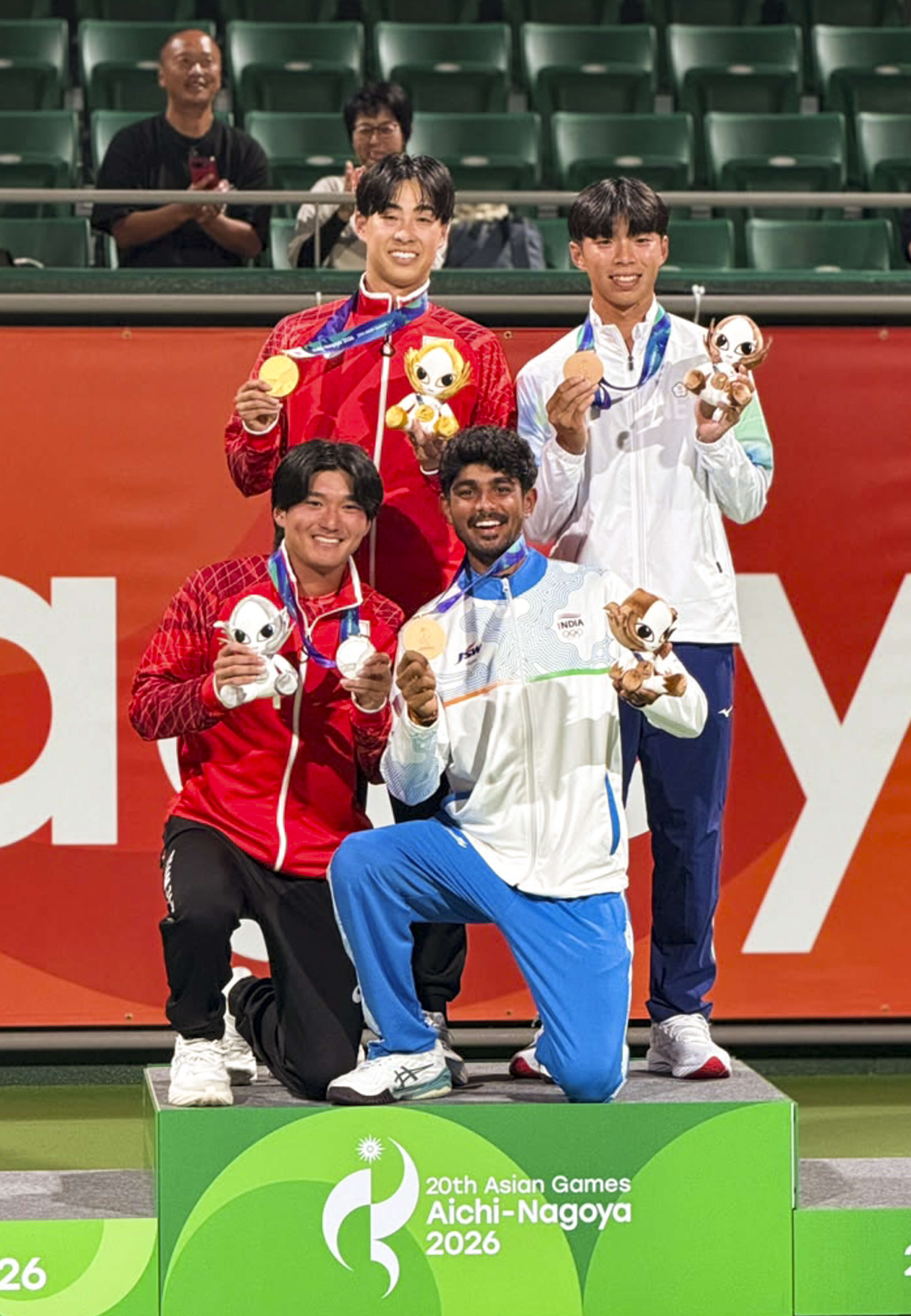 Jay Meena poses with medalists during soft tennis presentation ceremony at 20th Asian Games
