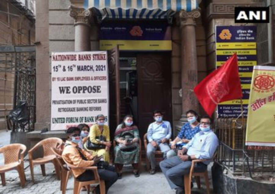 Employees sit on a strike outside a bank in Mumbai. Insurance companies will also go on a strike this week.
