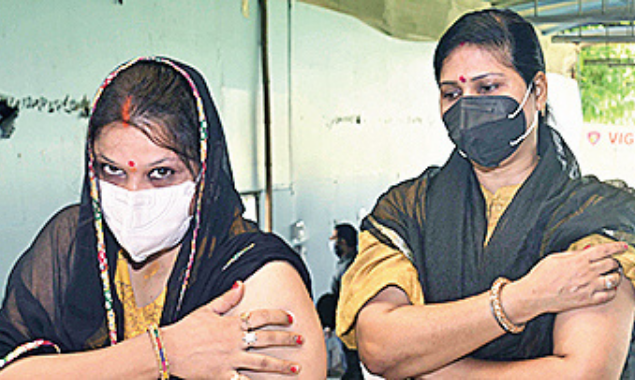 Two women after getting their first dose of vaccine at Patna Women's College on Wednesday