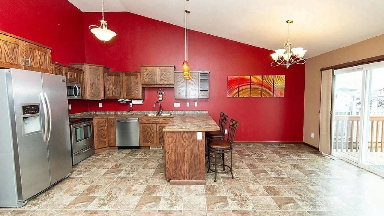 ​<strong>After five years of saving, couple give their red-and-orange kitchen a $9,037 makeover</strong>​