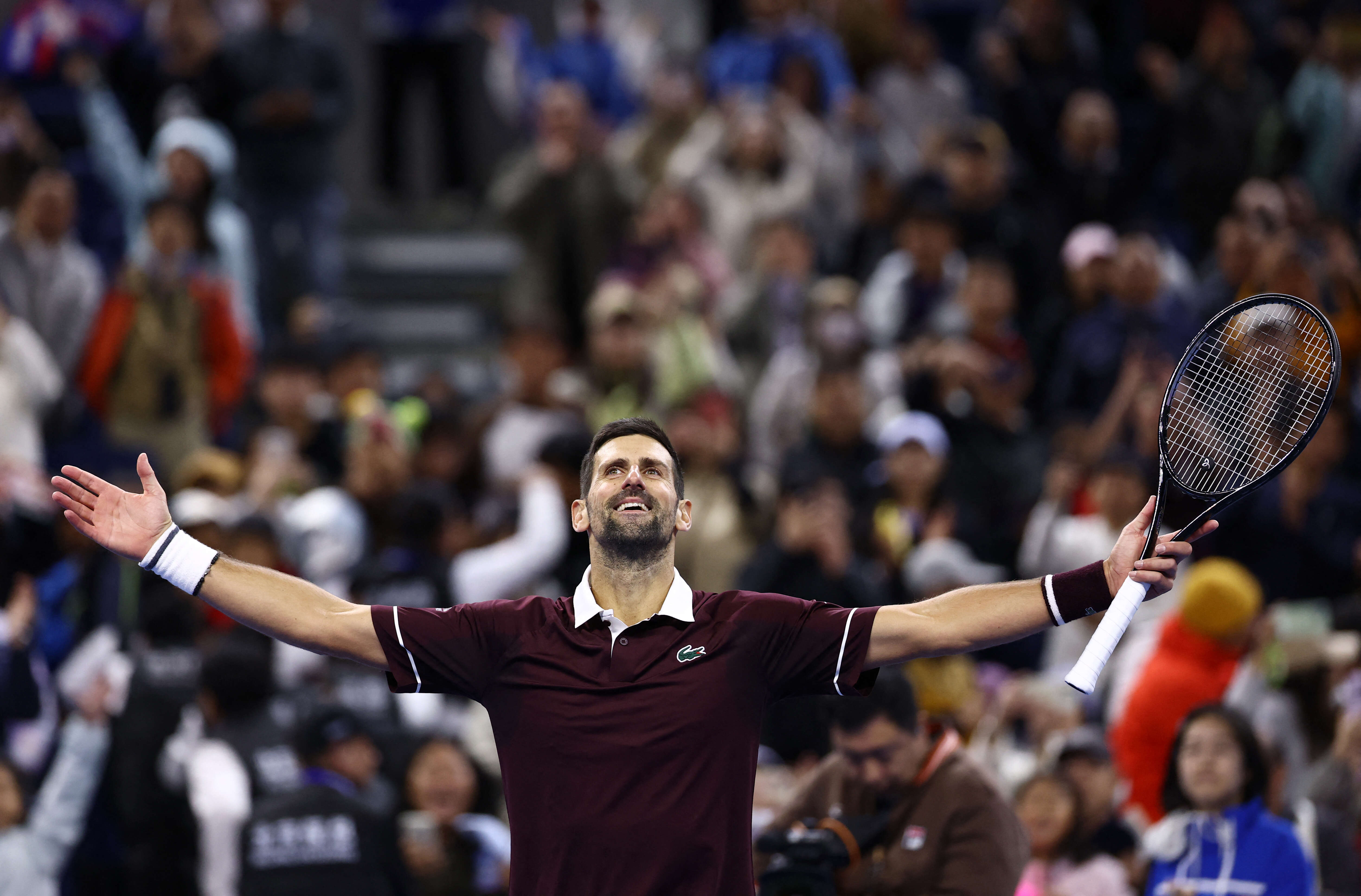 Tennis - China Open - National Tennis Center, Beijing, China - October 4, 2026 Serbia's Novak Djokovic celebrates after winning his quarterfinal match against Germany's Alexander Zverev REUTERS/