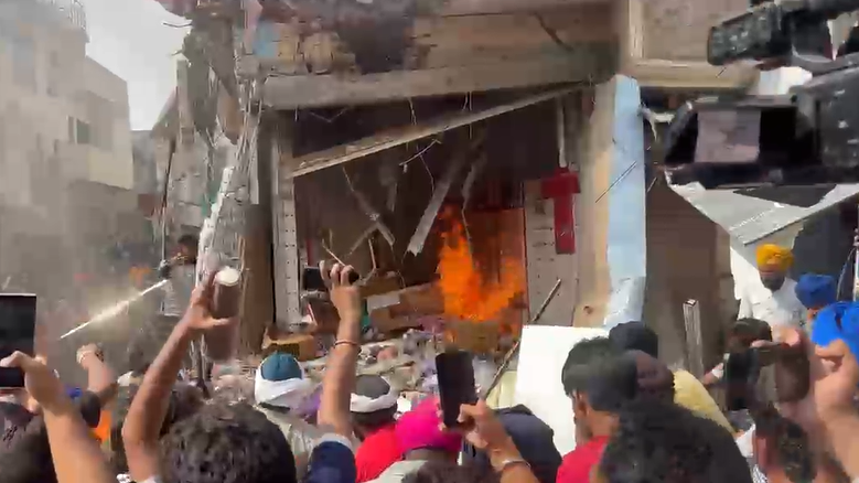 Locals set the accused's shop on fire<br>