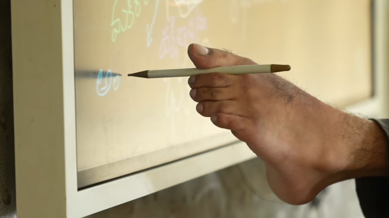 At 3, Naidu’s uncle began teaching him to draw lines with chalk between his toes.(Photo: BBC News Hindi)