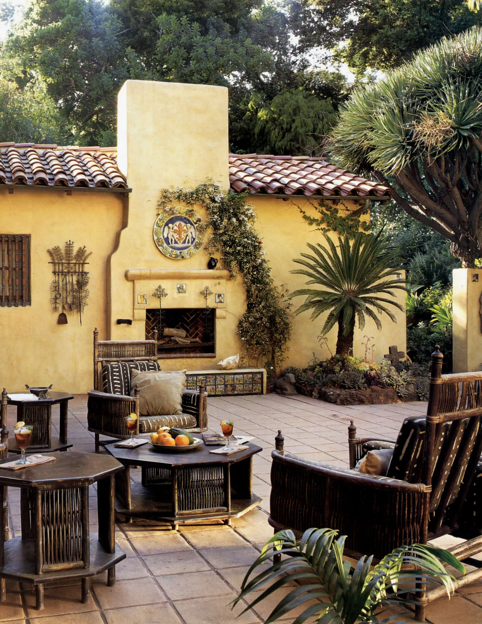 Tim Curry’s favourite courtyard became a year-round entertaining space, featuring Arts and Crafts furniture, a fireplace and tiles depicting the story of Don Quixote.