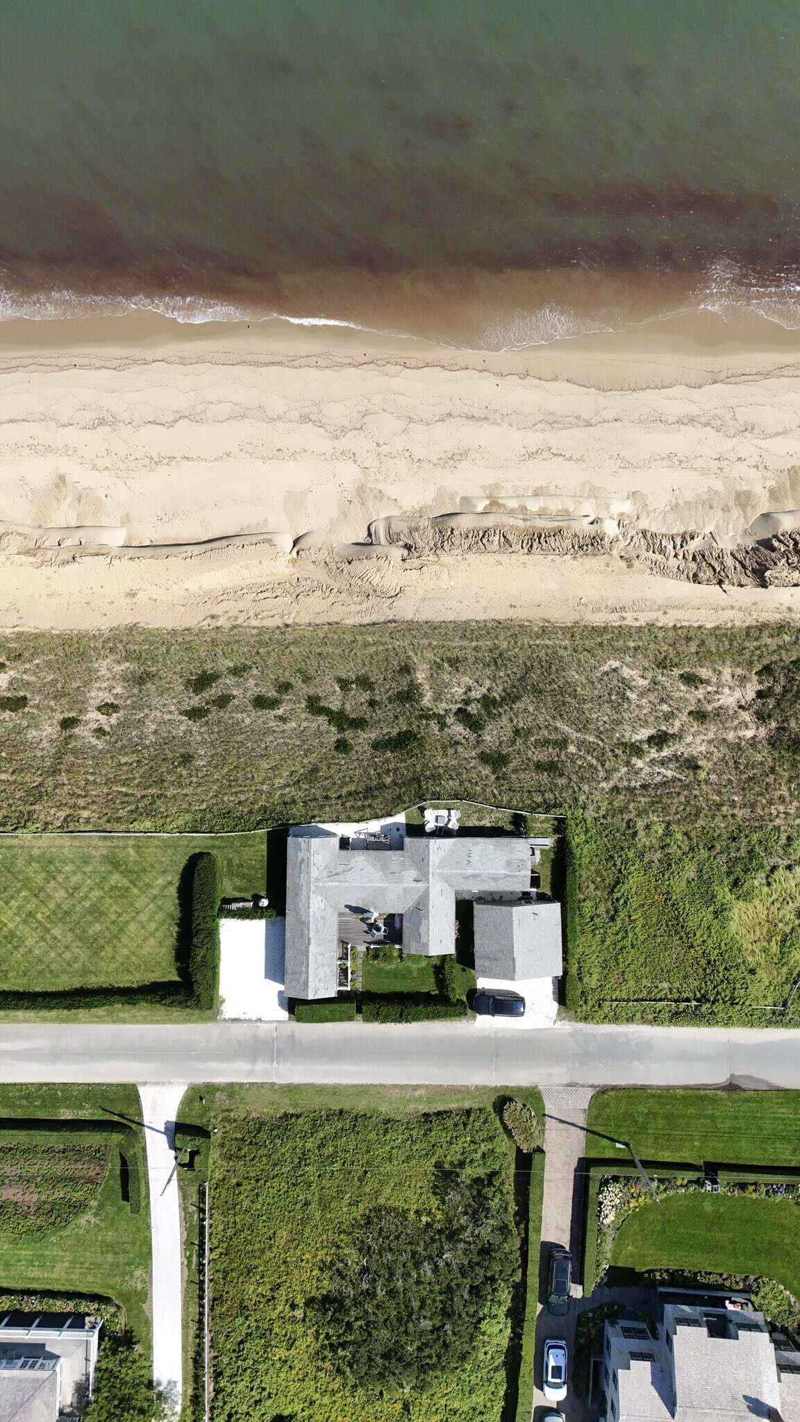 The cottage at 93 Baxter Road once had far more land between the house and the edge of the bluff.