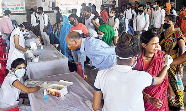 Passengers wait for their turn to get themselves tested at Patna Junction on Monday