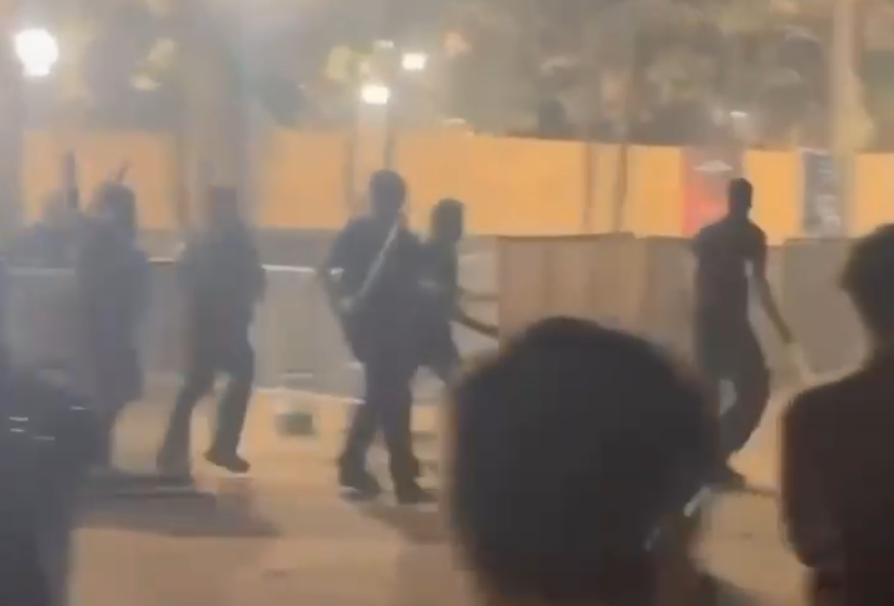 Video grab of bouncers attacking revellers with swords, sticks and chains at garba venue in Rancharda, Gandhinagar  (1).png