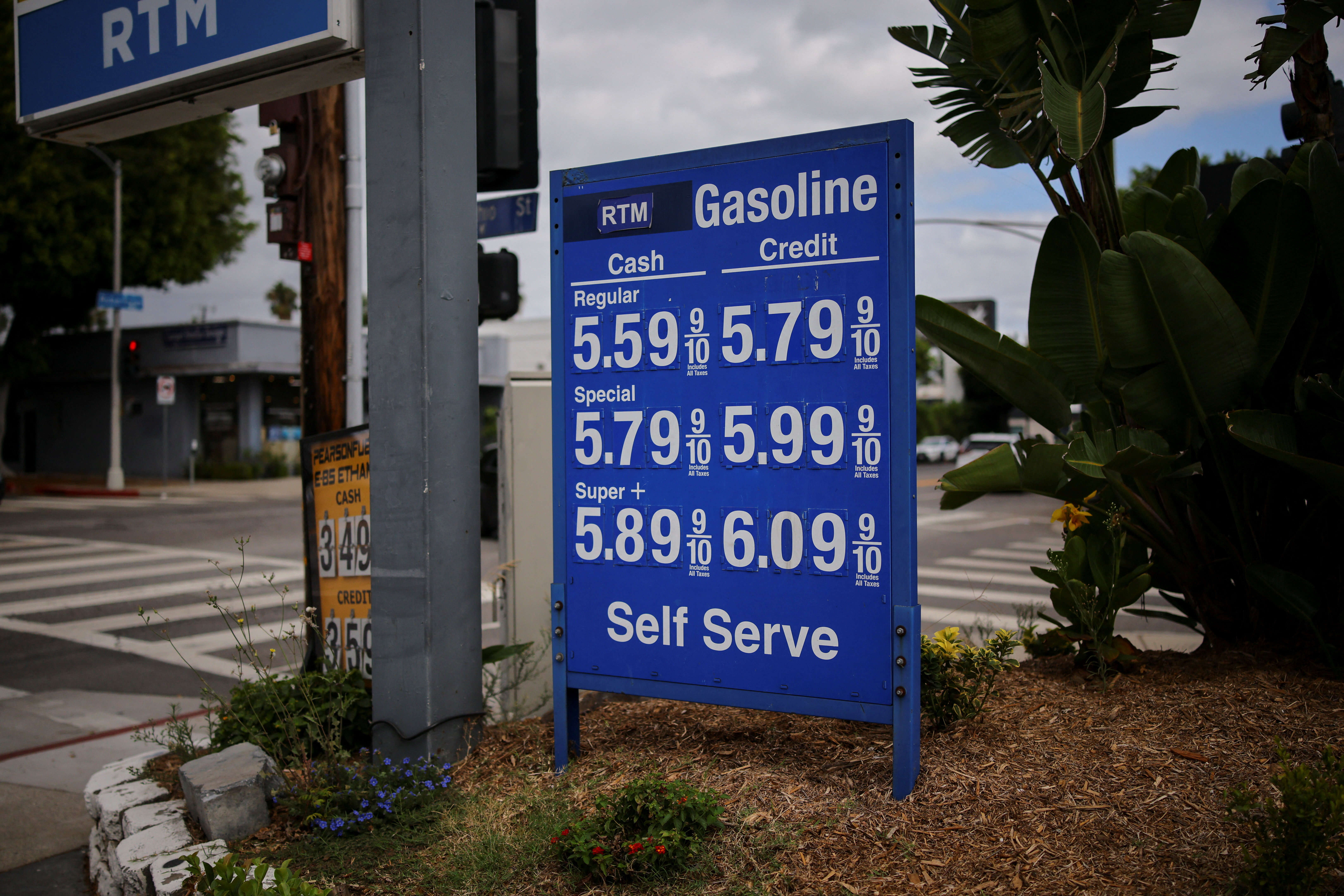 Gas prices are listed at a service station