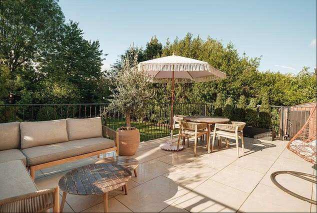 The Bramhall home has a large driveway, tandem garage and generous rear garden.