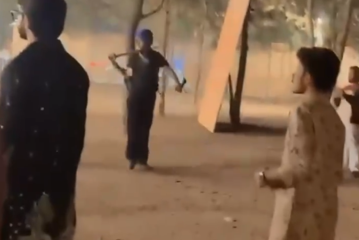 Video grab of bouncers attacking revellers with swords, sticks and chains at garba venue in Rancharda, Gandhinagar  (2).png