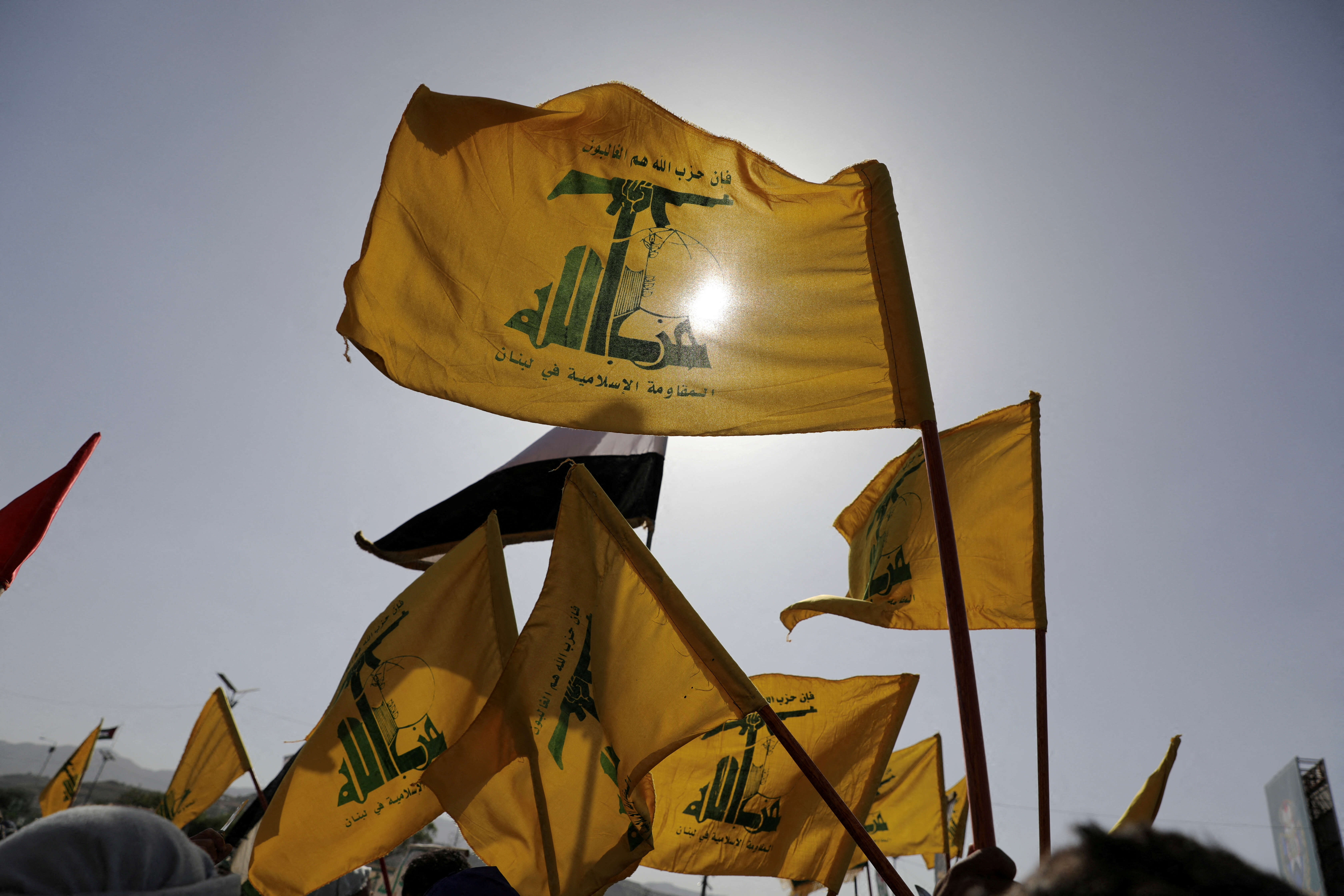 Hezbollah flags flutter as protesters, mainly Houthi supporters, rally to show support to Palestinians in the Gaza Strip and Lebanon's Hezbollah, in Sanaa, Yemen September 27, 2024.