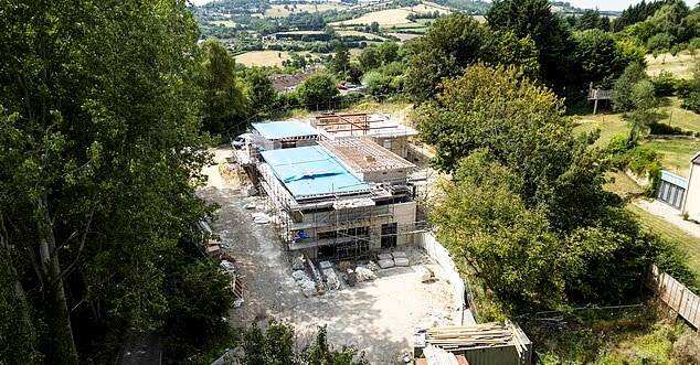 A millionaire developer says construction changes were necessary because of difficult ground conditions, as residents demand action over the £3 million property.