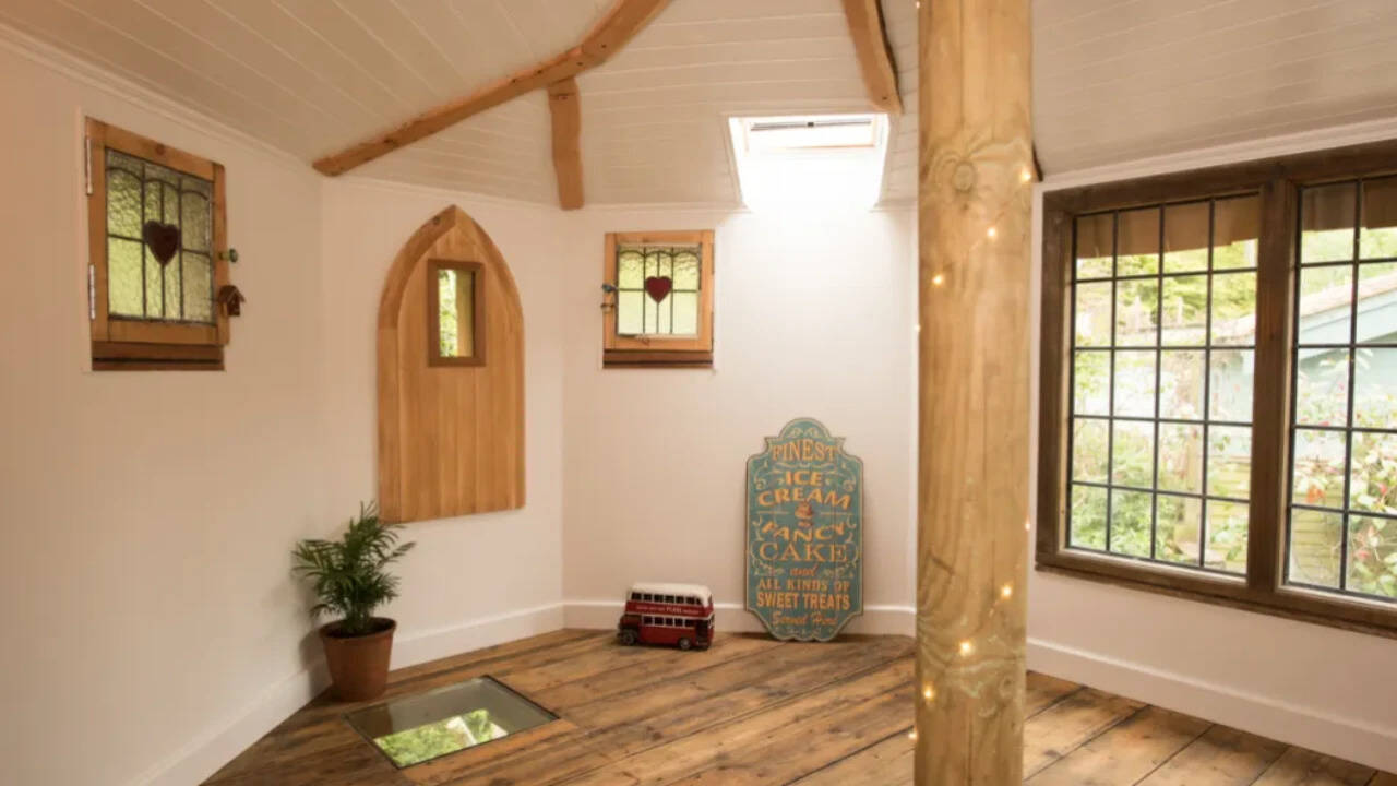 Visitors reach the top section through a trapdoor, which opens into a vintage-inspired living space