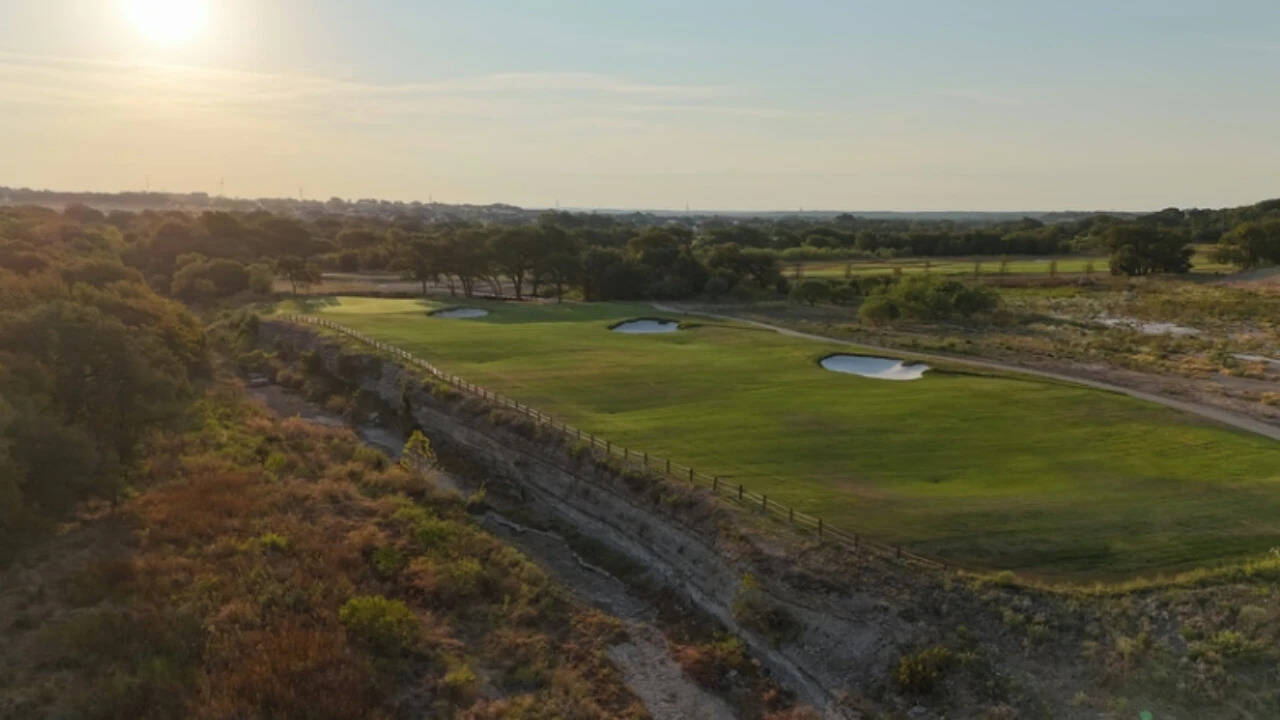 The community will have an 18-hole course and a shorter 10-hole course.