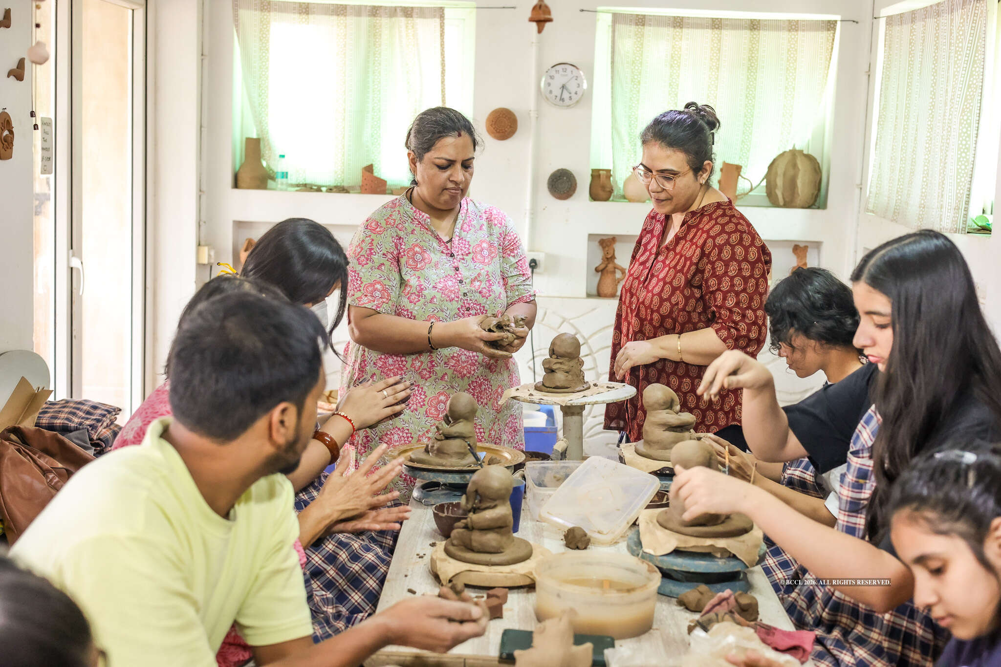 Pottery experts Anshu Aswal (L) and Pooja Verma (R) conduct a Ganpati-making workshop in Noida<br>