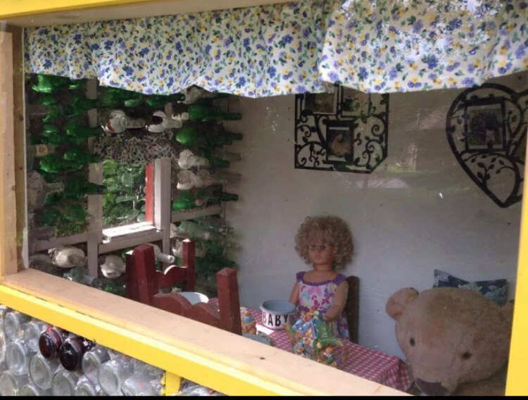 Myrtle wanted a house to display her growing doll collection, and Hank turned the idea into a bottle-built structure that later became a local tourist attraction