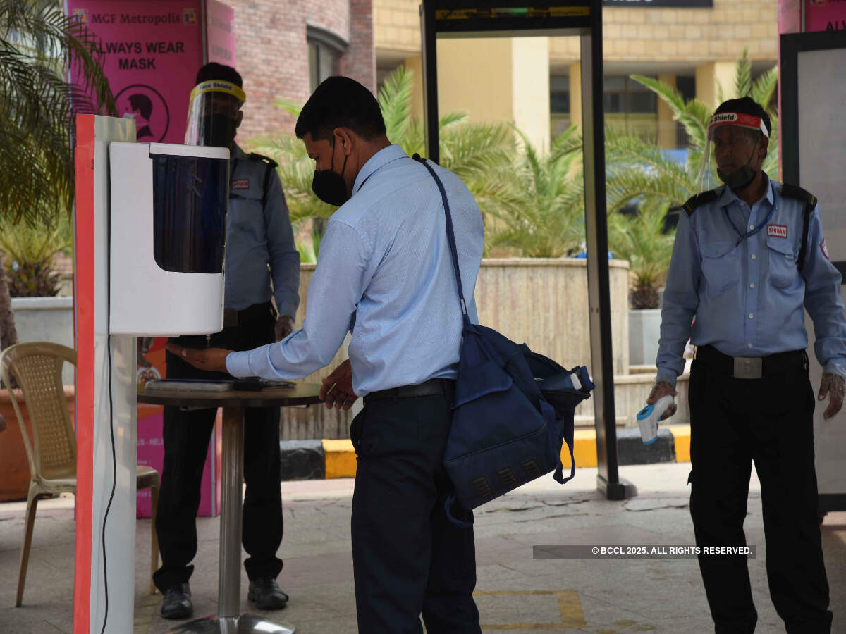 A visitor sanitises his hands at the mall