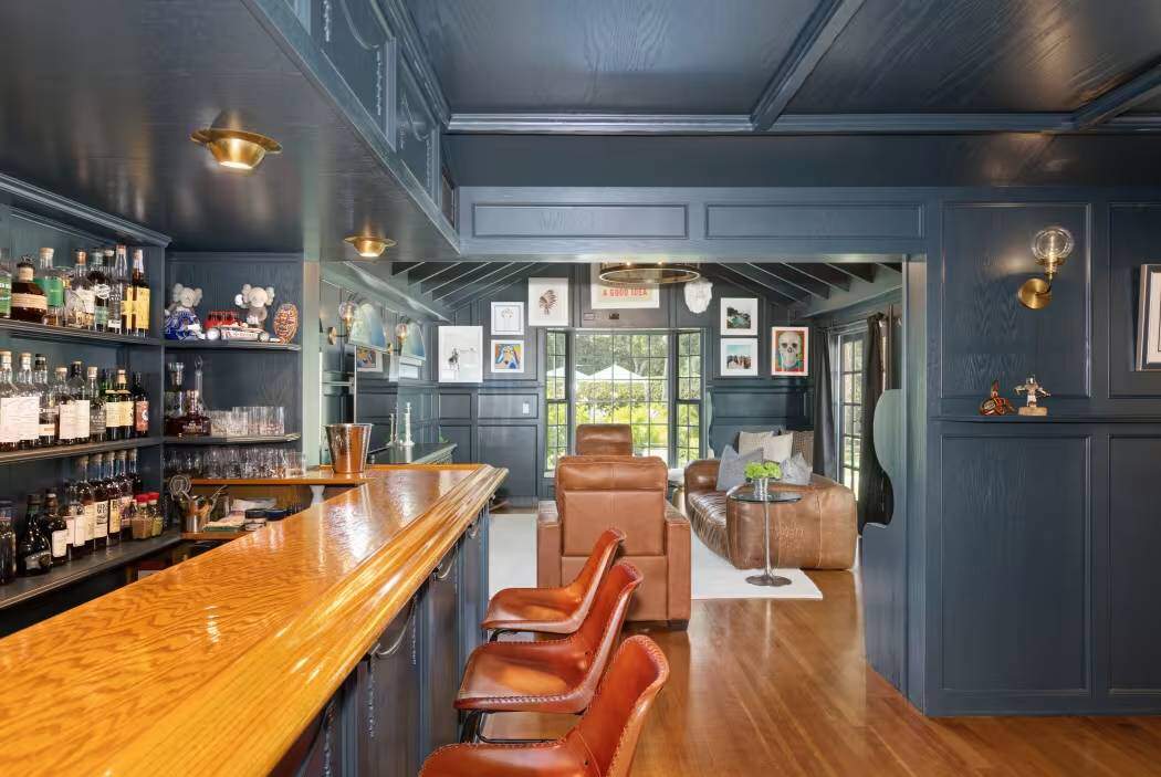The property also includes a pool, hot tub, four-car garage and separate guest accommodations.