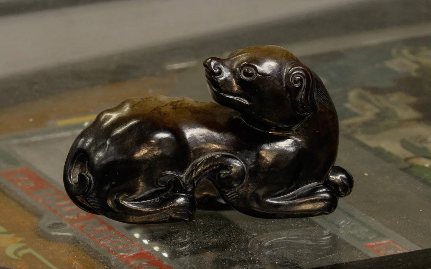 ​The tiny black-and-green jade dog, discovered in a box, could fetch up to £10,000 when it goes under the hammer.