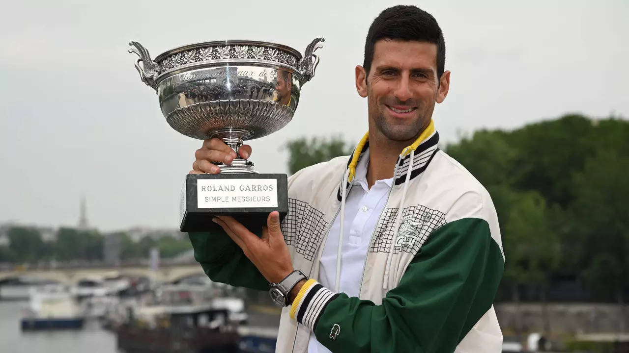 Novak Djokovic poses with the Musketeers' Trophy in Paris on June 12, 2023. (AFP Photo)