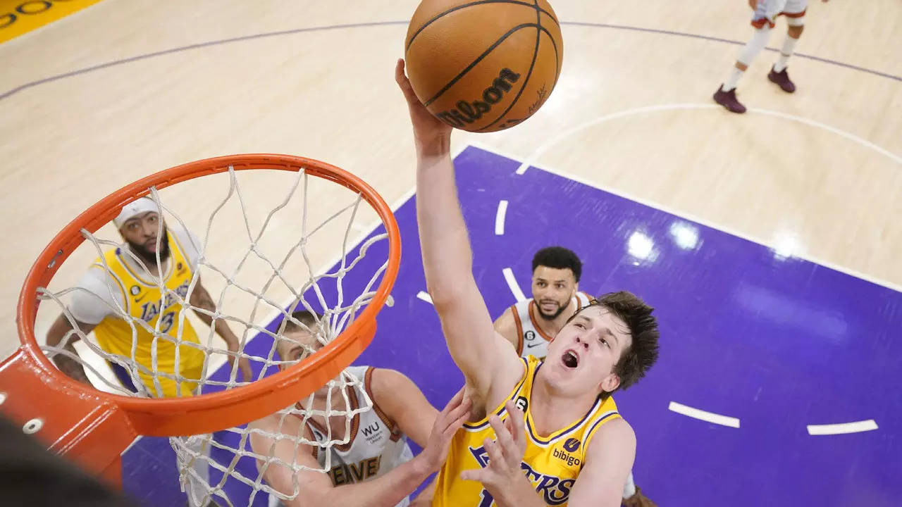 File image of Los Angeles Lakers' guard Austin Reaves, front right, attempting to net a basket (AP Photo) 