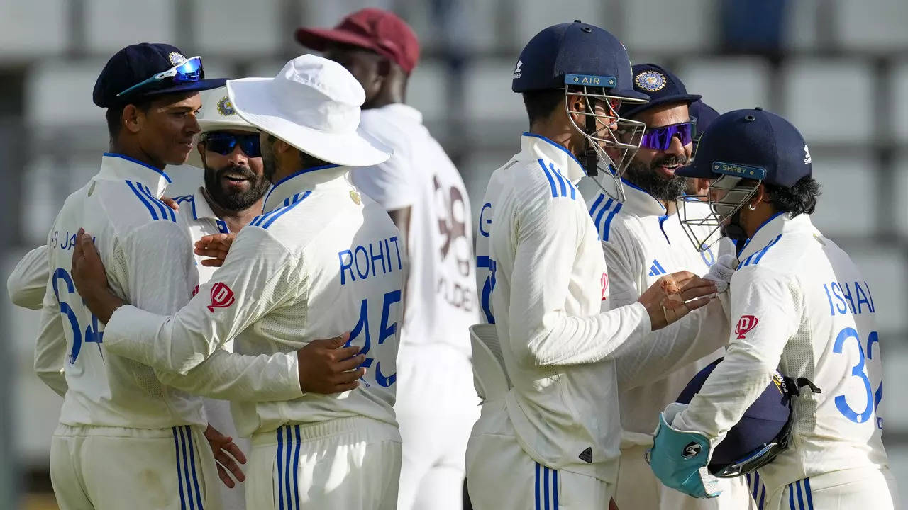 India players celebrate after defeating West Indies for an innings and 141 runs on day three of their first Test. (AP Photo)