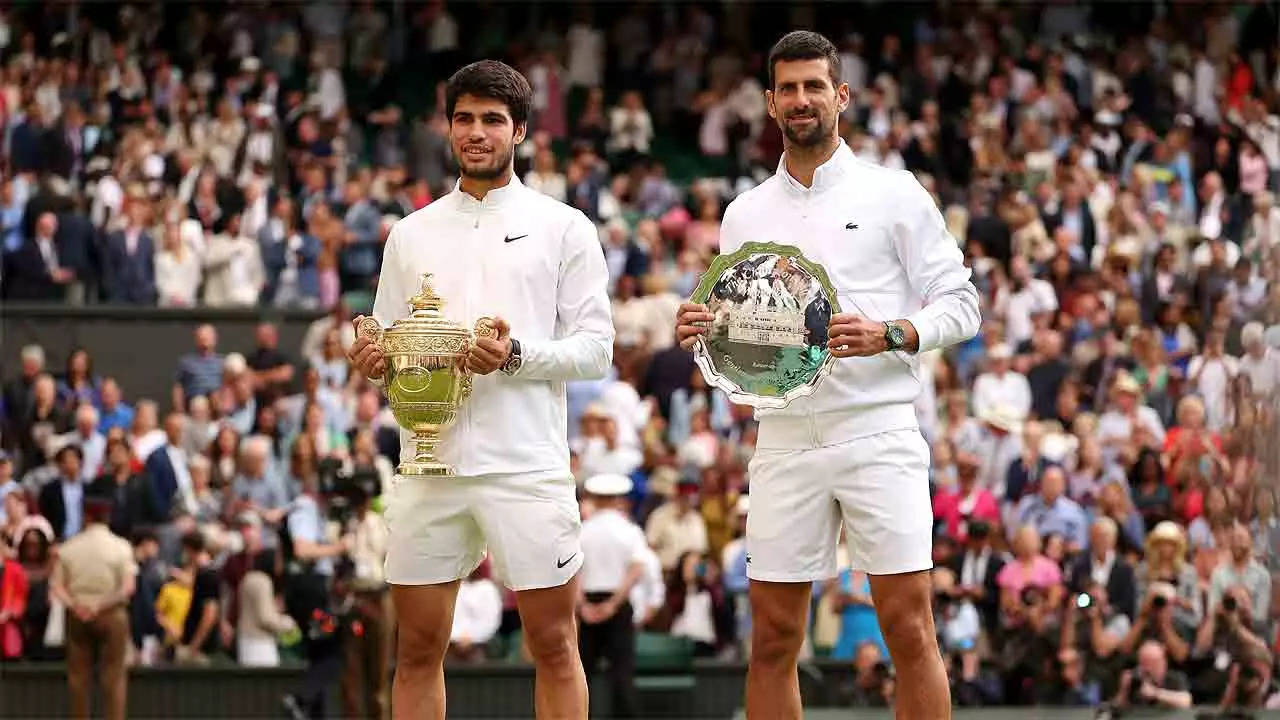 Carlos Alcaraz and Novak Djokovic after the Wimbledon final. (Photo by Julian Finney/Getty Images)