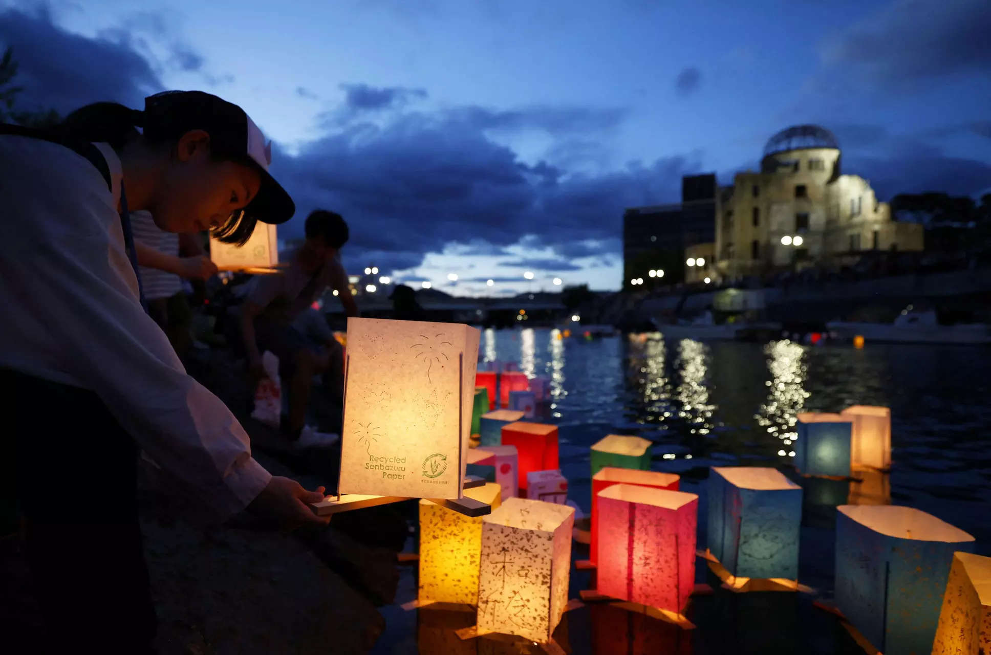 People release paper lanterns on the Motoyasu River facing the gutted Atomic Bomb Dome in remembrance of atomic bomb victims on an anniversary of the atomic bombing of the city in Hiroshima 