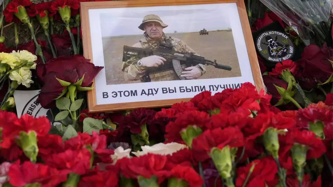 Flowers along with an image of the Wagner chief Yevgeny Prigozhin (Image: AP)