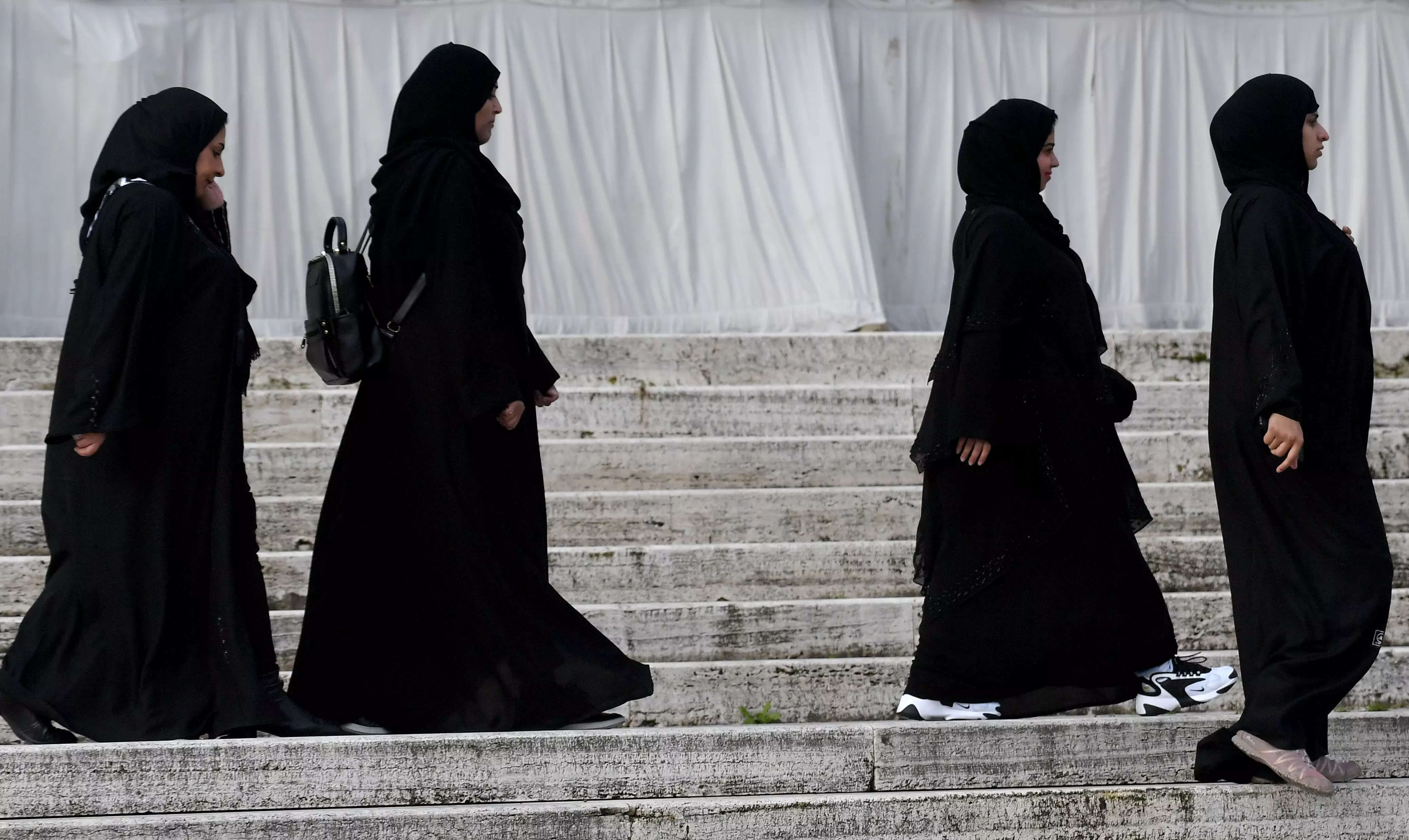 France to ban wearing Islamic abayas in schools - Times of India