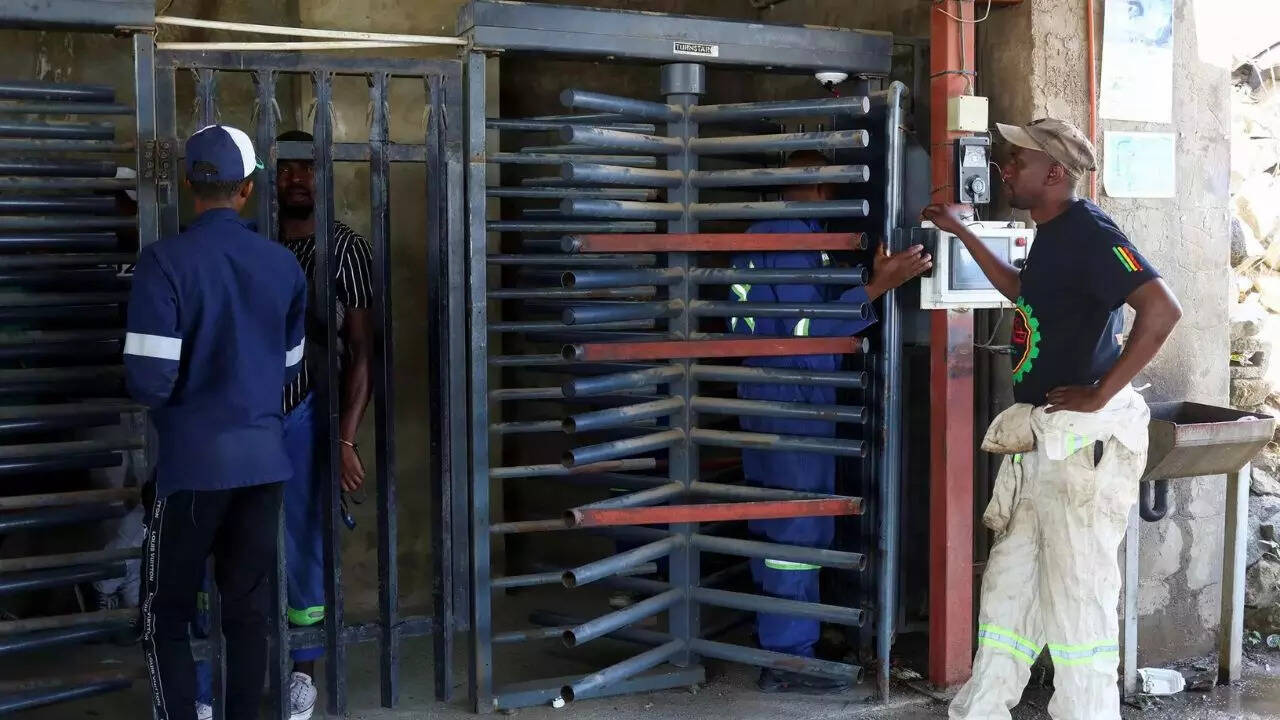 Miners from a rival union hold hundreds of colleagues underground at a gold mine in South Africa