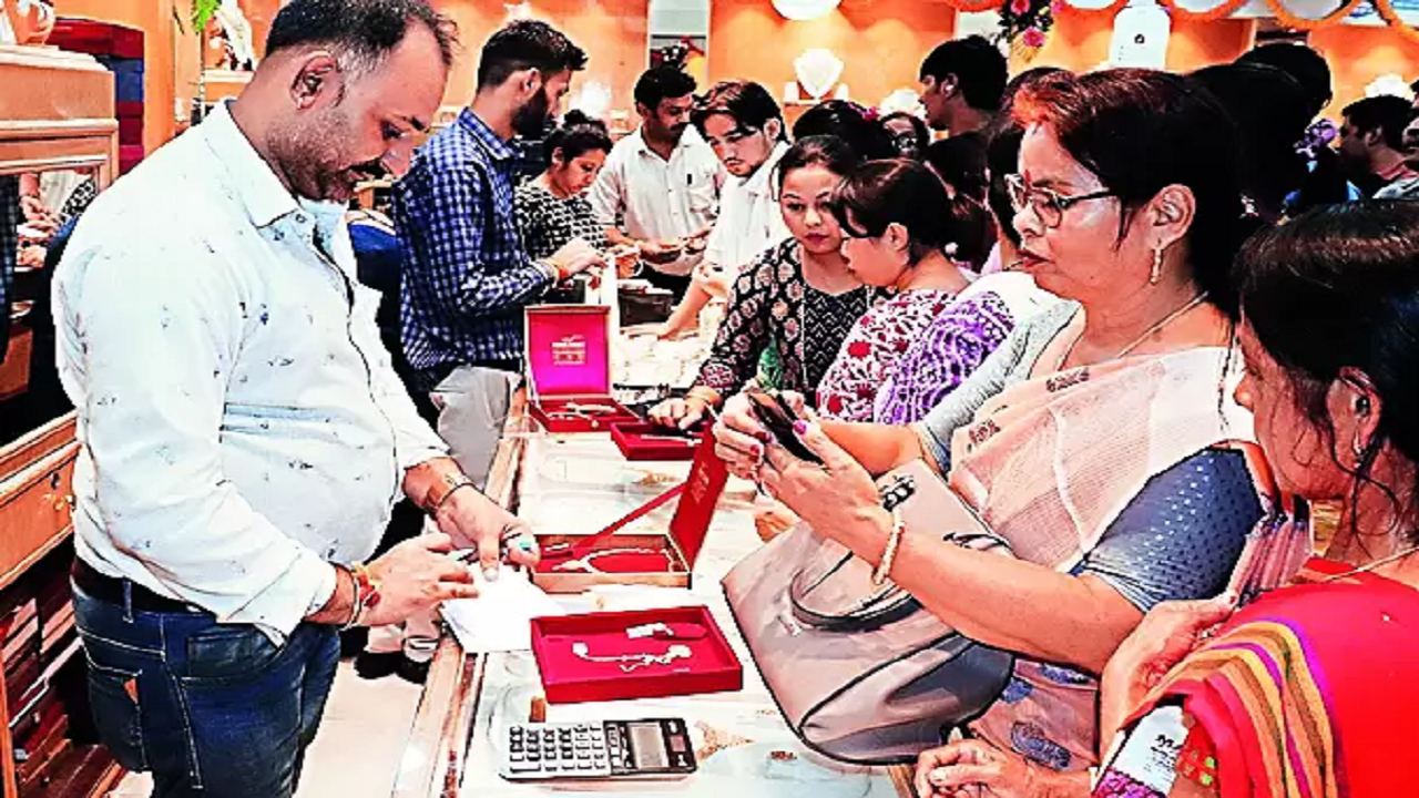 Customers purchase jewellery on Dhanteras at a shop in Guwahati 
