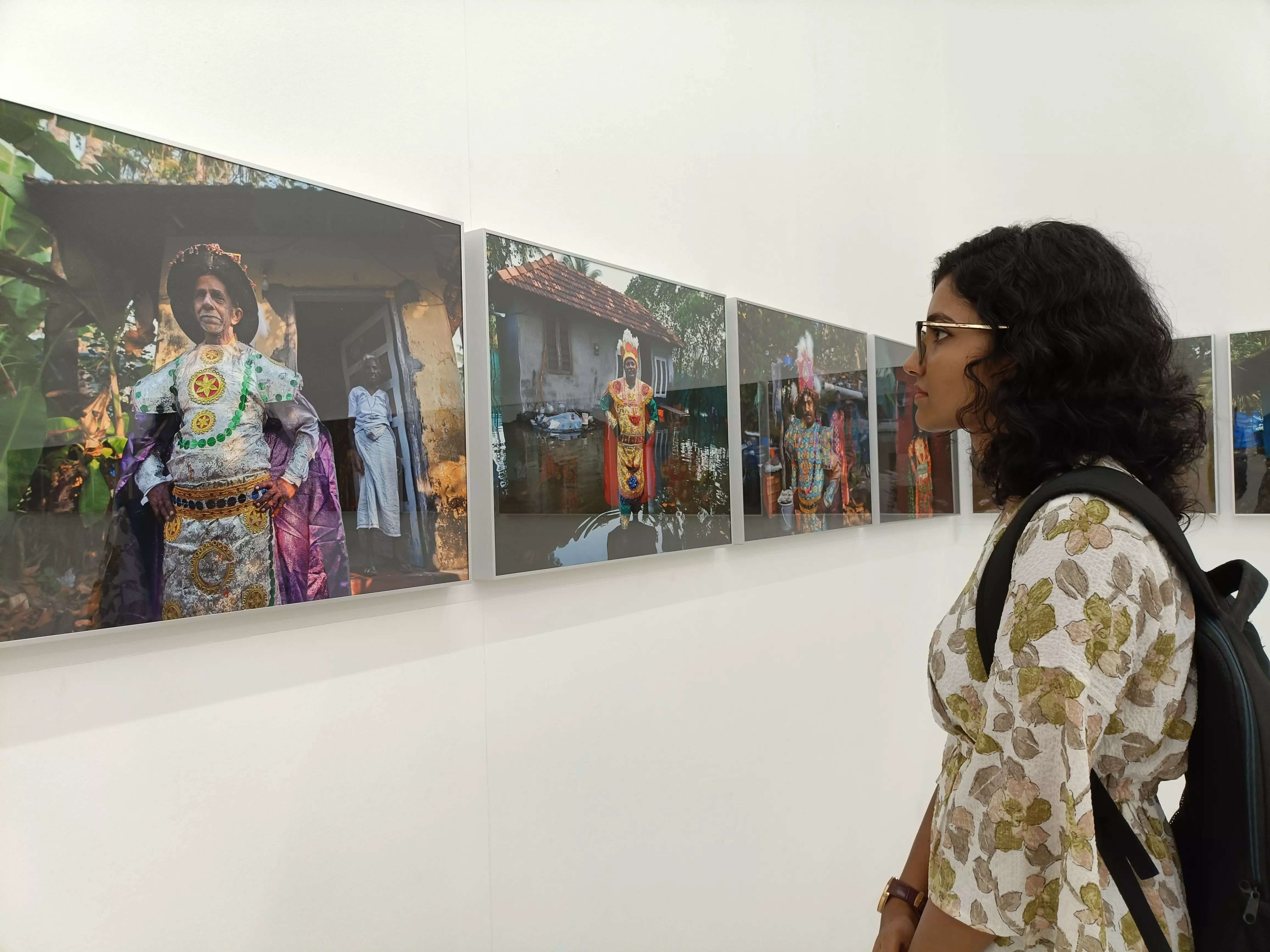 An art enthusiast checking out KR Sunil's photographs depicting the life of Chavittunatakam artists in Kochi, post- flood