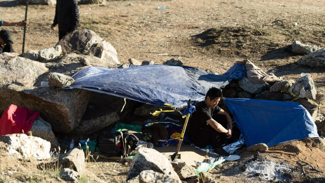 'A new normal': Migrants huddle in open-air camps on US border