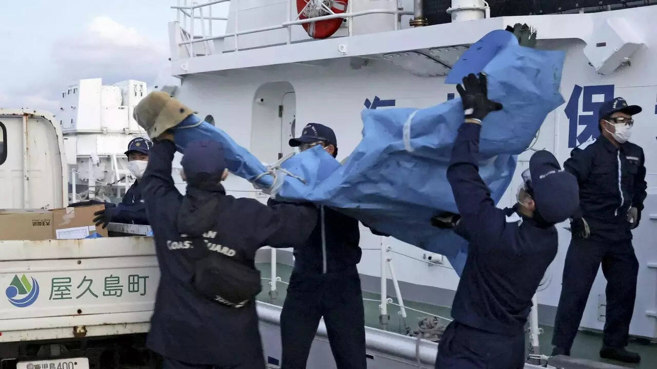Divers recover the seventh of 8 crew members killed in crash of a US military Osprey off Japan