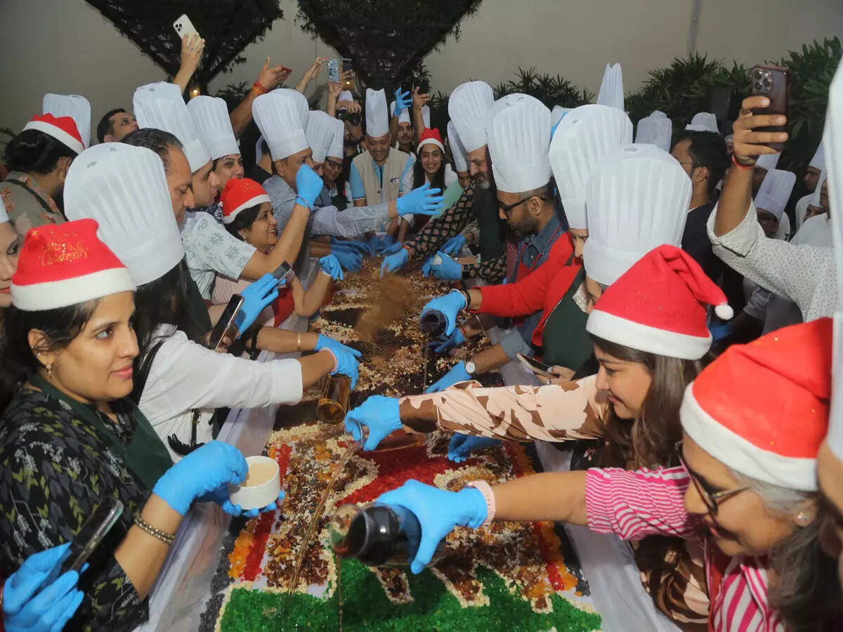 Joyful cake mixing ceremony in a city hotel