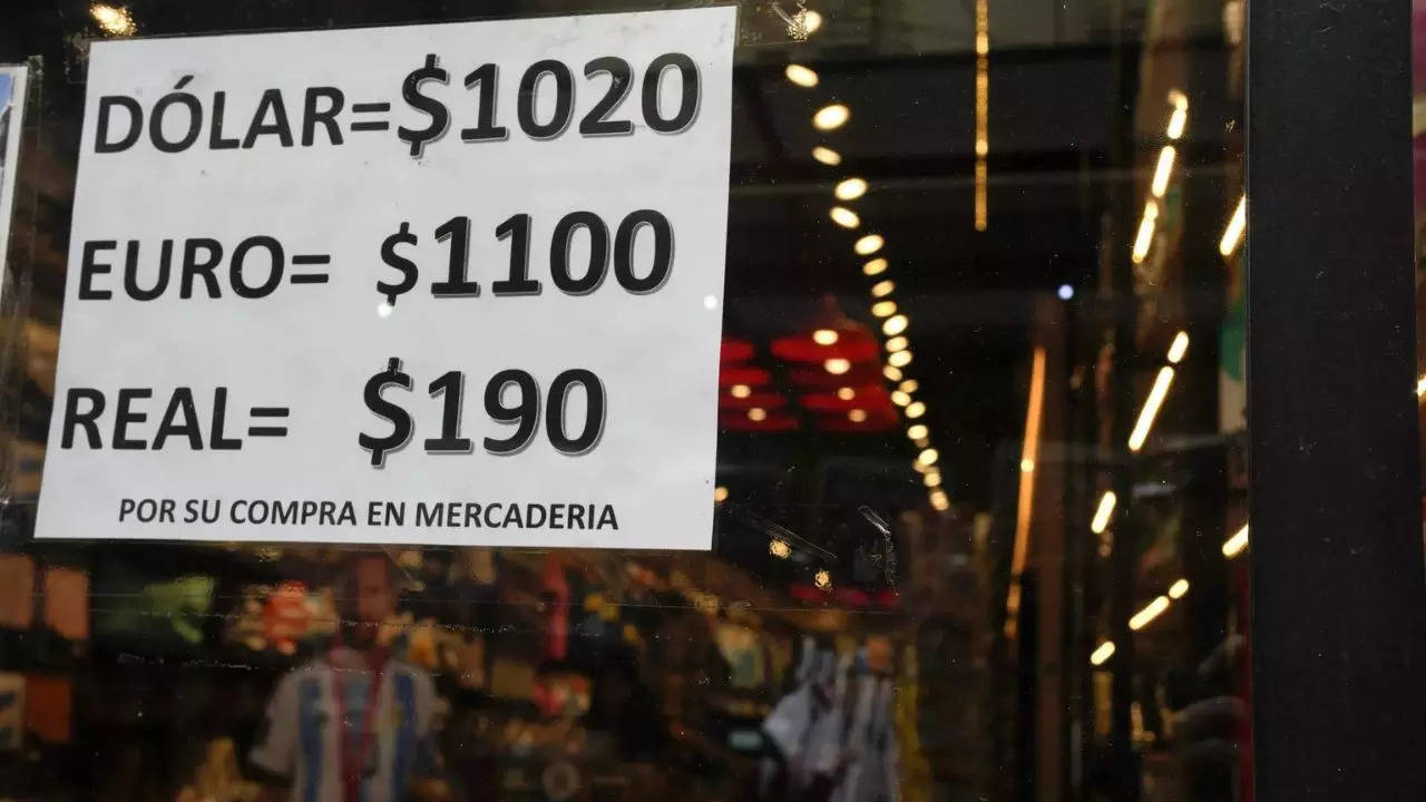 Argentina devalues its currency, cuts subsidies as part of shock economic measures