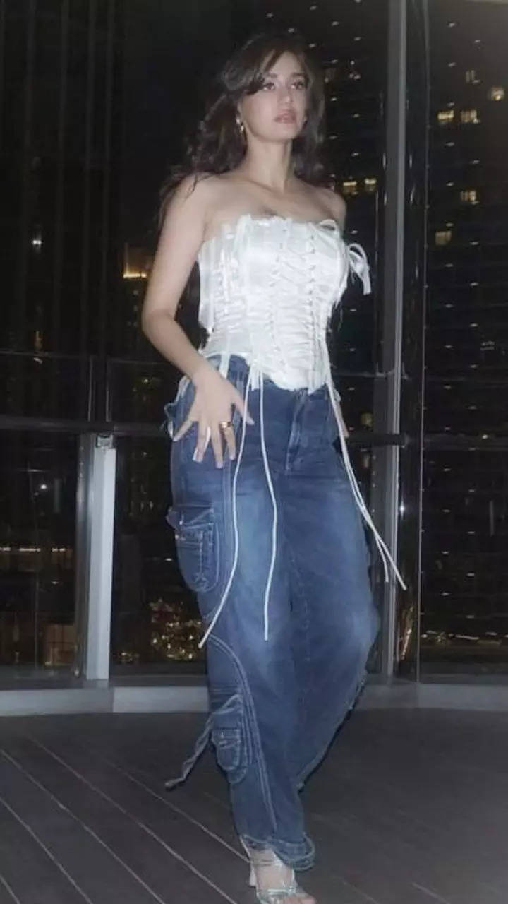 Disha Patani’s trend recreation reaches new heights in a white corset prime and blue denims