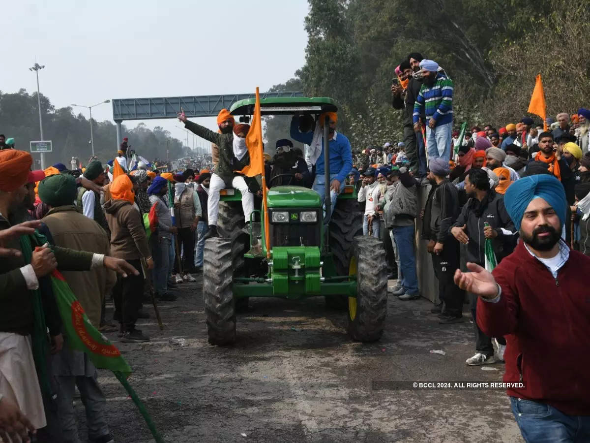 Farmers gather near the Punjab-Haryana Shambhu border during their 'Delhi Chalo' march.