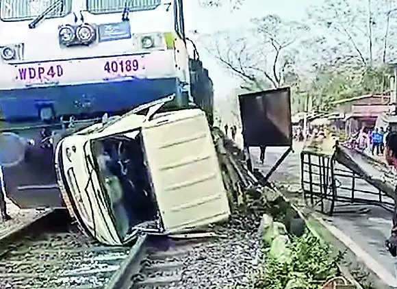 Narrow escape for 2 as train hits vehicle at unmanned crossing | Guwahati News – Times of India