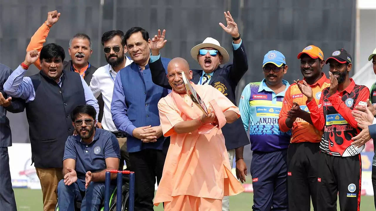 BEST FOOT FORWARD: CM Yogi Adityanath tries his hand with the bat during a match. (TOI Photo)