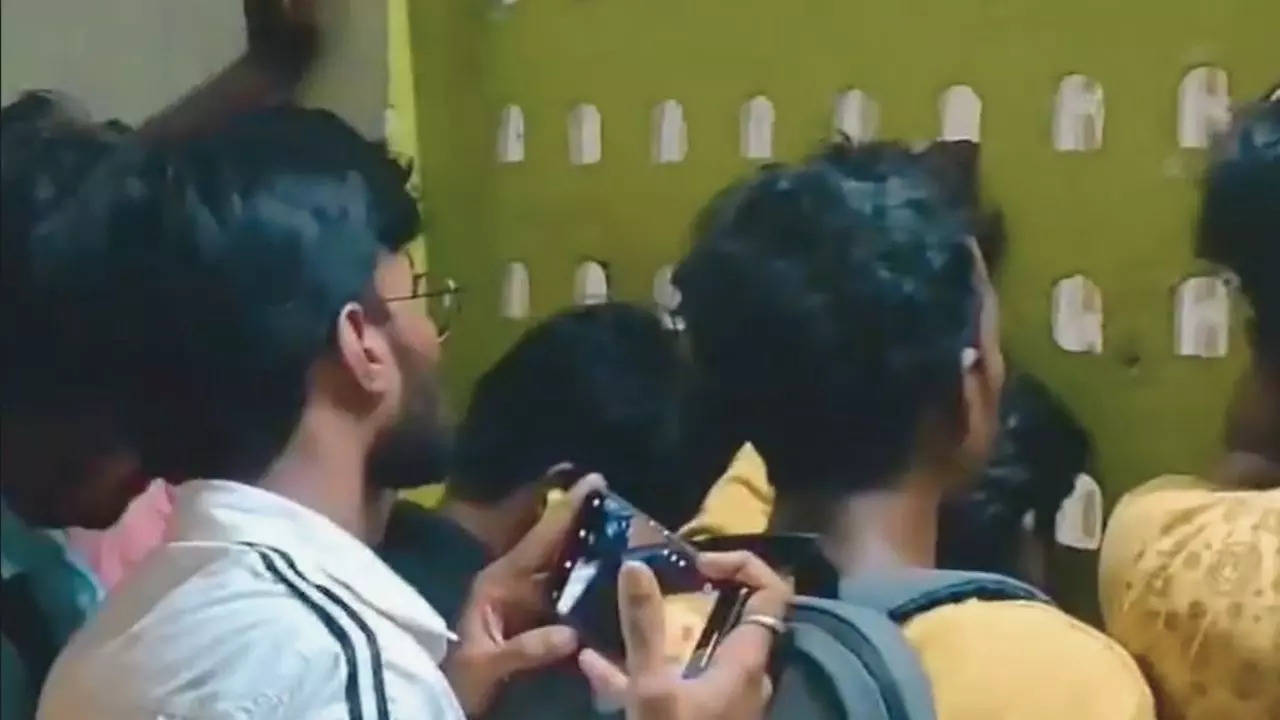 Watch: Fans peep through railway station vents to watch IPL opener